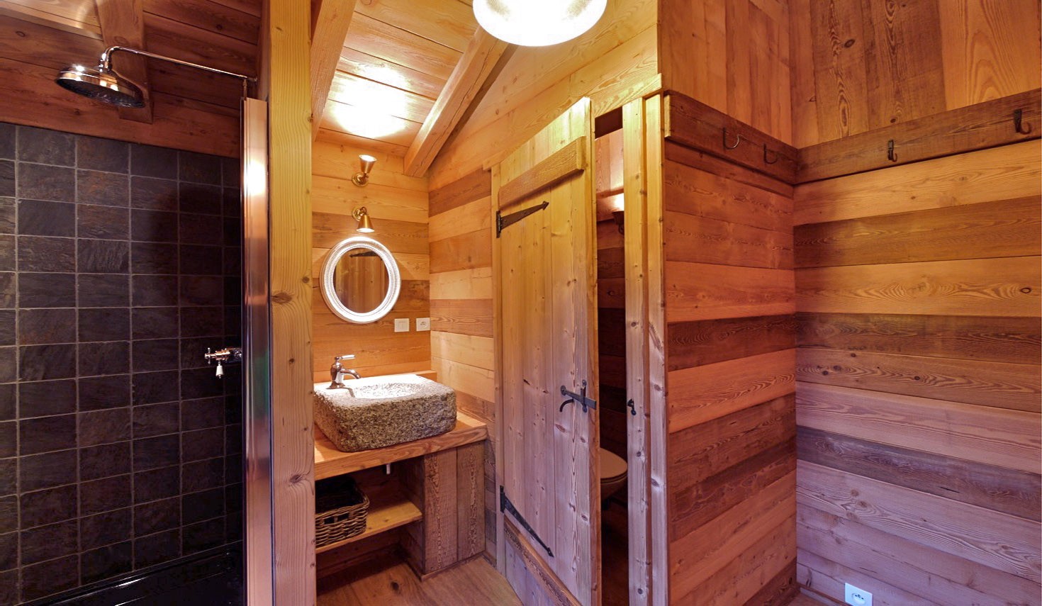 In the mazot: slate tiled shower, granite basin and WC