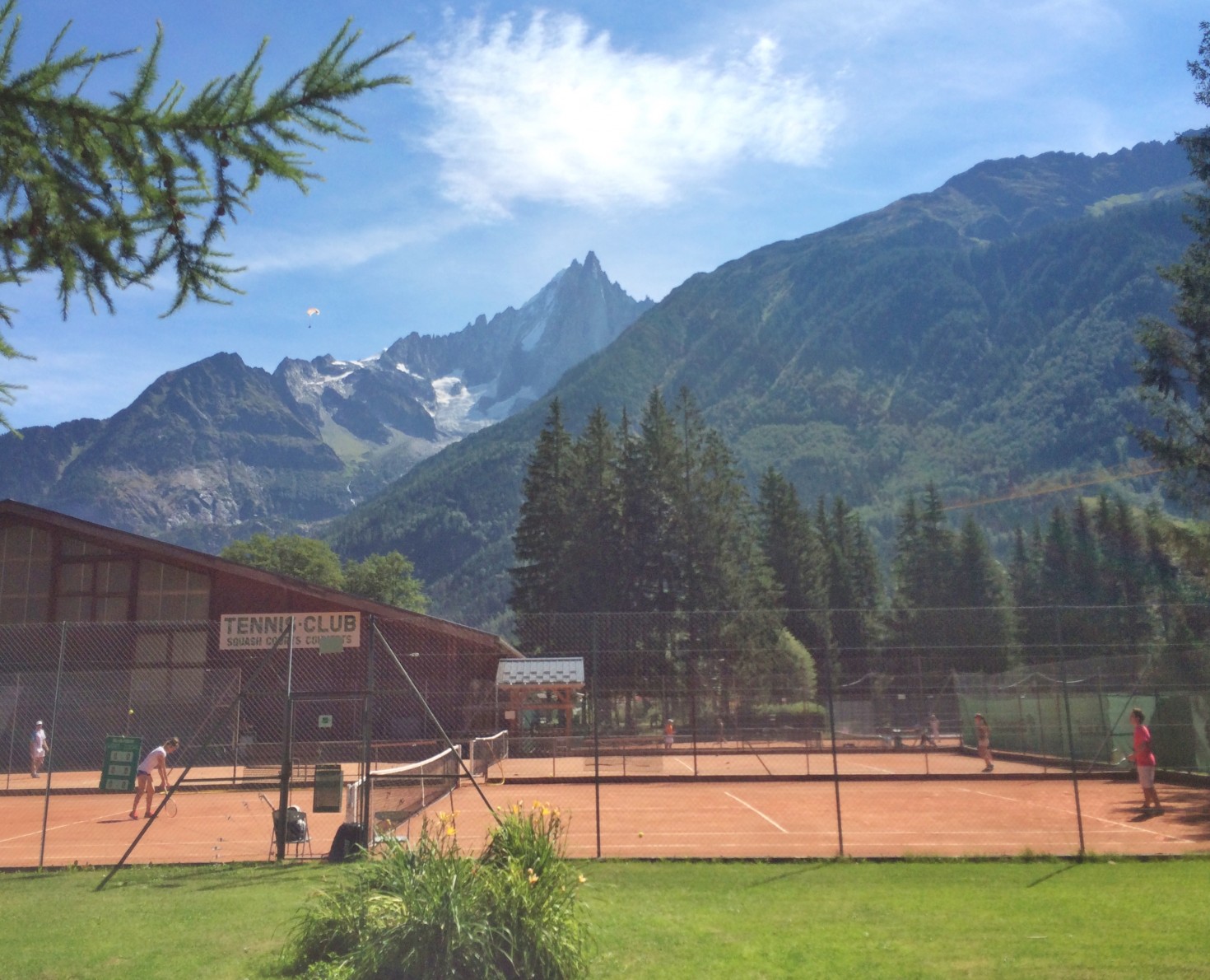 Indoor court building and outdoor courts.